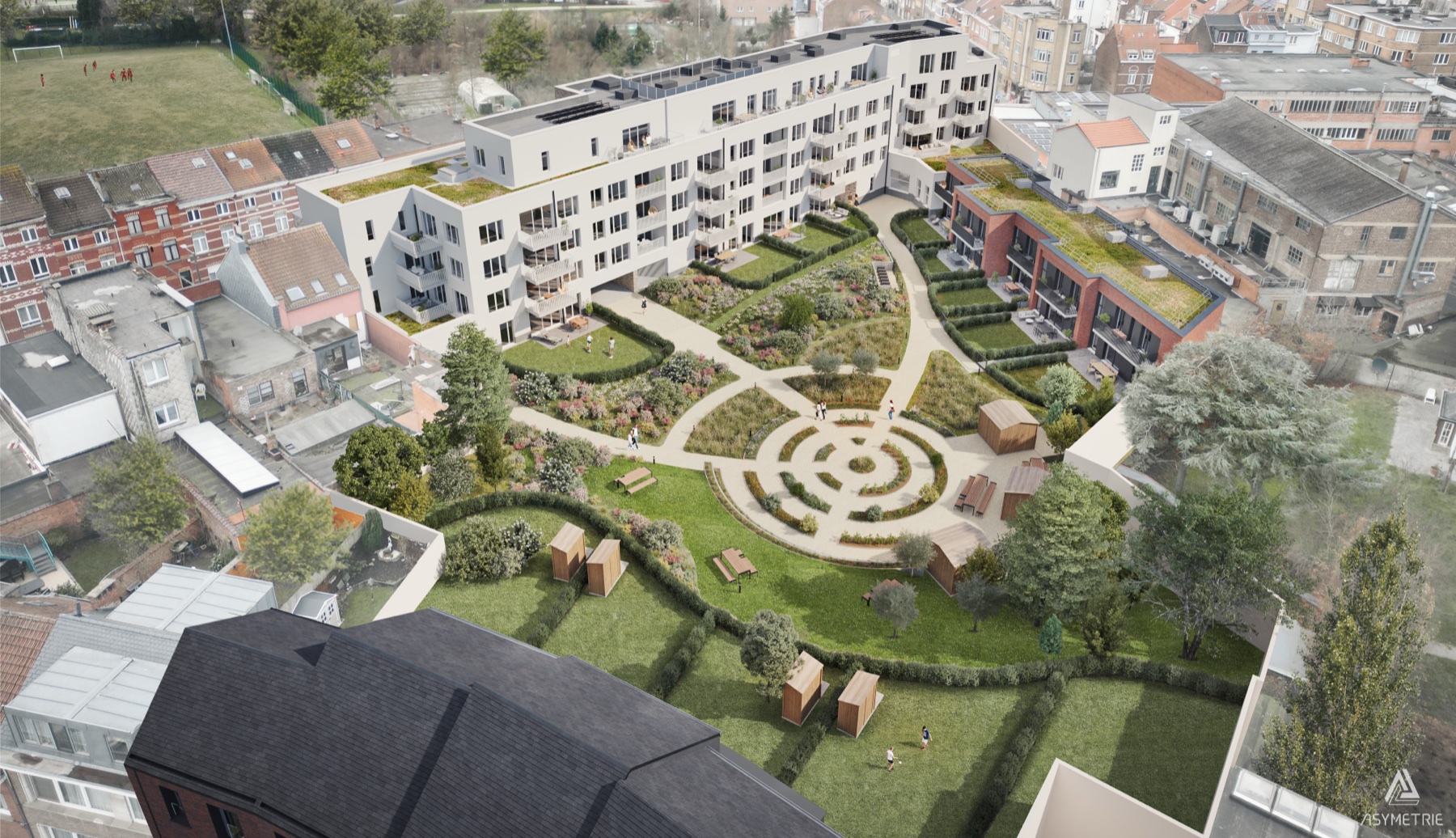 Vue aérienne de GreenForest : les logements organisés autour du jardin partagé et son labyrinthe planté.